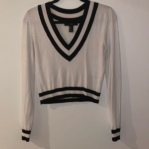 Black and white cropped sweater with a V-neck